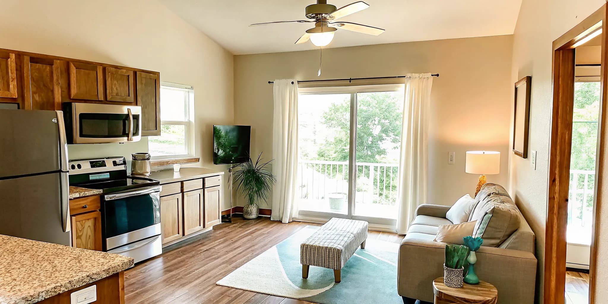 Clean, bright Oklahoma apartment kitchen and living room