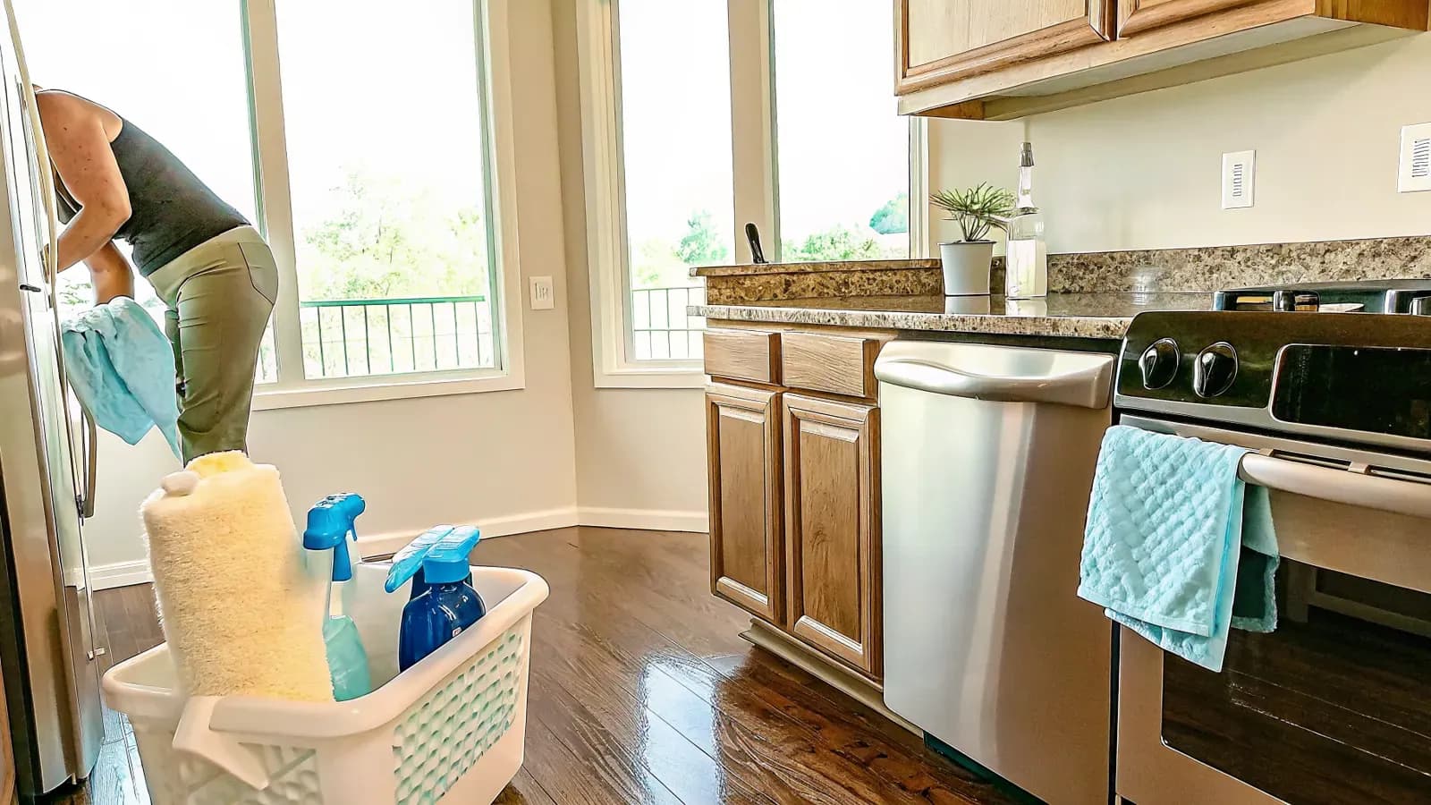 Professional using a kitchen deep cleaning checklist in a bright family kitchen